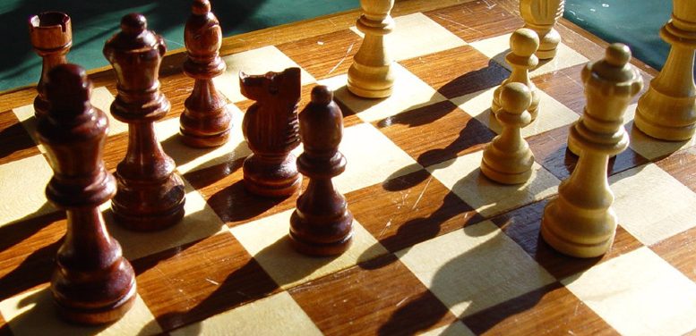 Wooden chess board and pieces